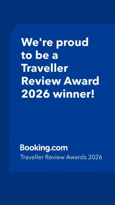 a blue sign that says were proud to be a traveller reviewagency winner at Family home close to Shrewsbury Town centre in Shrewsbury