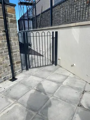 an iron gate in front of a building at The New 2 Plas Morolwg in Aberystwyth