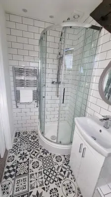 a bathroom with a shower and a sink at The Cwtch in Brecon