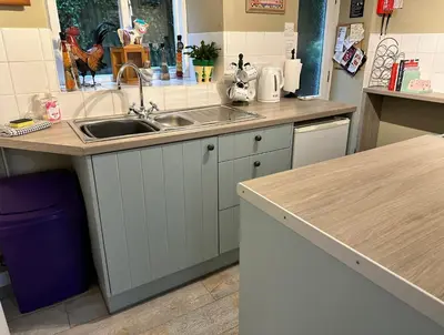 a kitchen with a sink and a counter at Llanidloes Townhouse-pet-friendly-sleeps 7-Mid Wales in Llanidloes