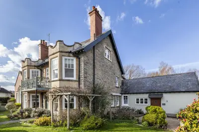 an old brick house with a chimney on top at The Agents House, Bed & Breakfast in Hay-on-Wye