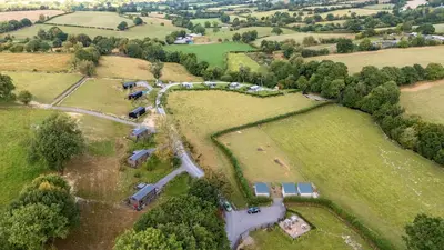 an aerial view of a farm with a group of farms at The Otter in Rhayader