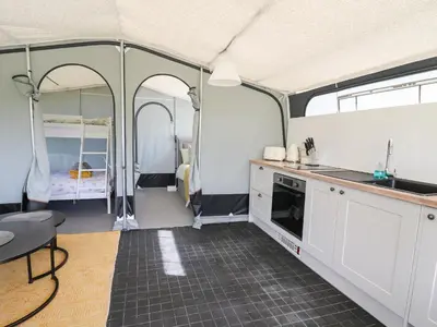 a kitchen and living room in a tent at The Kingfisher in Rhayader