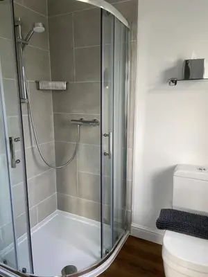 a shower stall in a bathroom with a toilet at Marshpools Bed & Breakfast - Licensed near Weobley village in Weobley