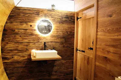 a bathroom with a sink and a mirror at Burrow View in Rhayader