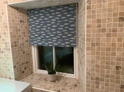 a window in a bathroom with a curtain with hearts at Cwmbach Cottage, Hay on Wye in Glasbury