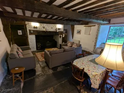 a living room with a couch and a table at Longhouse - Hen Dy in Rhayader