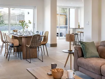 a living room with a table and a couch at Dau Ddeg in New Quay