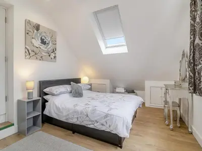 a bedroom with a bed and a skylight at The Old Nursery in Sennybridge