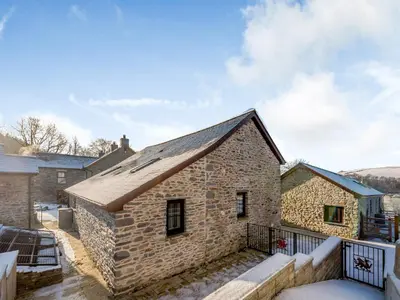 an old stone building with a roof at Ty Gwair - Uk41512 in Lampeter