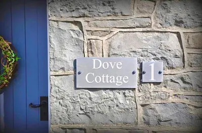 a sign on a stone wall that reads dye cartridge at Dove Cottage in Newbridge on Wye