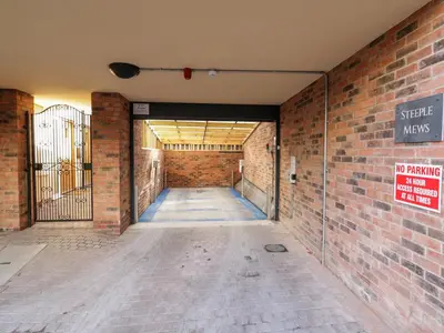 an empty hallway with a brick wall and a no parking sign at The Stokesay in Ludlow