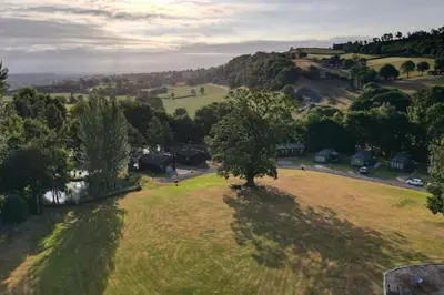 an overhead view of a field with a tree in it at Valley View Lodge in Welshpool