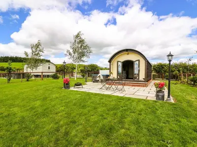 a gazebo in the middle of a yard at Mountain View Pod in Rhayader