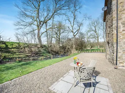 a table and two chairs sitting on a patio at The Mill in Llandegley