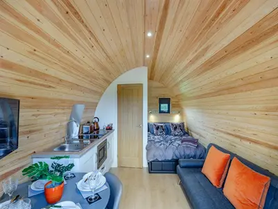a living room with a large wooden ceiling at Chestnut Uk36261 in Llanfair Caereinion