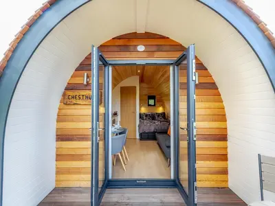 an arched doorway into a house with a living room at Chestnut Uk36261 in Llanfair Caereinion
