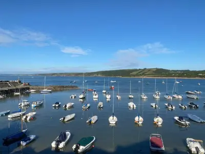 a bunch of boats are docked in a harbor at Y Ty Glas - Cottage in New Quay