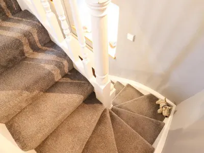 a set of stairs with a teddy bear on the floor at 3 Ivy Court in Dolgellau