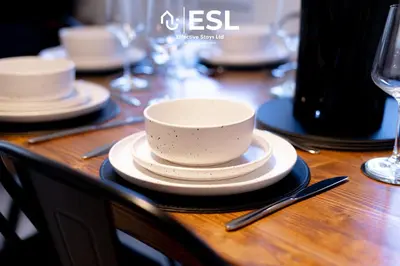 a wooden table with a cup and plates on it at 5 Bedroom Victorian Town House - Perfect for Contractors and Family Groups in Shrewsbury