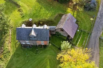 an aerial view of a large house in a field at Finest Retreats - Great Cantal Granary in Llandrindod Wells