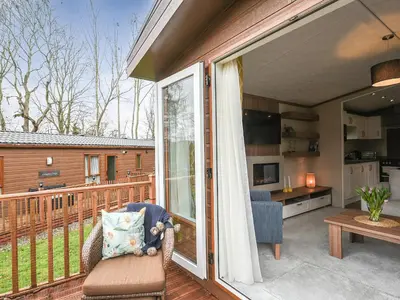 a patio with a sliding glass door leading to a kitchen at Marlow Lodge in Hyssington