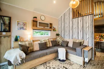 a living room with a couch in a room at Hillside Lodge in Nantmel