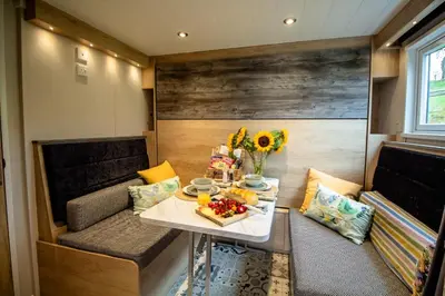 a small room with a table with a tray of food at Hillside Lodge in Nantmel