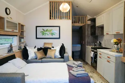 a small living room with a bed and a couch at Oak Tree View in Nantmel