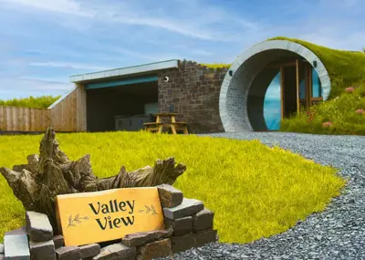 a view of a house with a sign in front of it at Valley View in Llanfair Caereinion