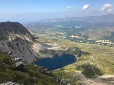 a view of a lake on the side of a mountain at Y Cwtch - Panoramic mountain views within Snowdonia's National Park - 4x4 only in Dolgellau