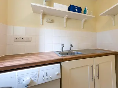 a kitchen with a sink and a dishwasher at Cosy 2 bedroom Victorian Cottage - Pass the Keys in Ludlow