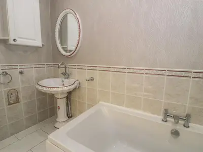 a bathroom with a sink and a bath tub at Bryn Berthen in Penrhyndeudreath