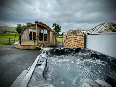 a large tub of water in front of a house at Snowdrop in Rhayader