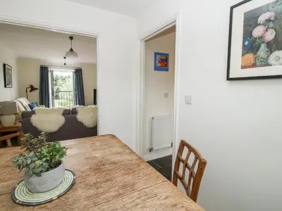a living room with a table and a couch at 30 Poplar Close in Shrewsbury