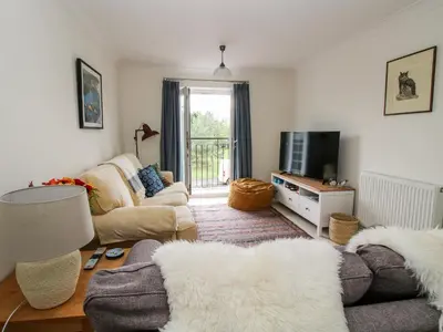a living room with a couch and a tv at 30 Poplar Close in Shrewsbury