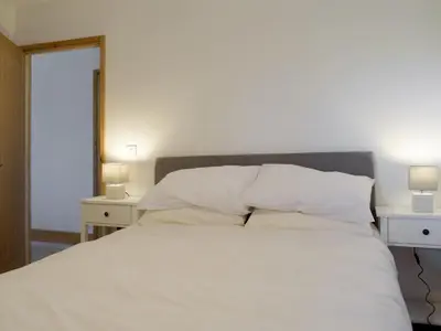 a bedroom with a bed with white sheets and pillows at Red Kite Lodge - Uk32610 in Old Radnor