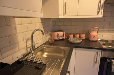 a kitchen with a sink and a counter top at Ground floor well appointed cosy flat in Ludlow in Ludlow