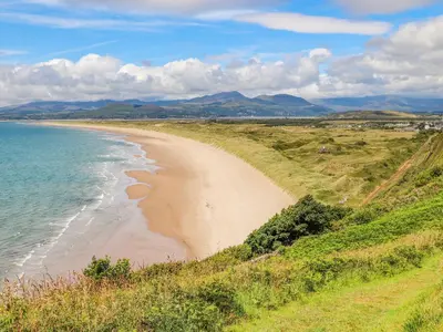 a view of a beach with the ocean at Bramble Bank in Harlech