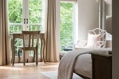 a bedroom with a desk and a chair next to a window at Luxury Cottage near Hay-on-Wye in Llanigon