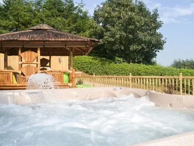 a gazebo with a fountain in a yard at Gwynfan Bungalow in Llandrindod Wells