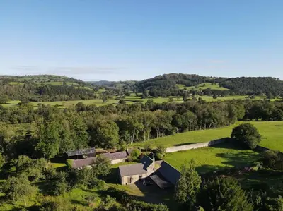 an aerial view of a farm in a field at Tranquil getaway near Brecon Beacons in Llandovery