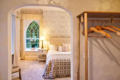 a bedroom with a bed and a window at Ty Bledrws - family retreat near the Cardigan Bay coast in Llangybi