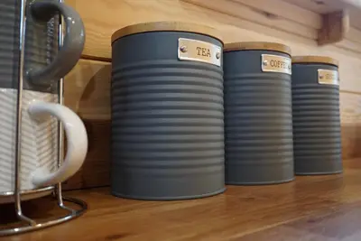 a row of blue lenses sitting on a shelf at Eastridge Glamping Pods in Shrewsbury
