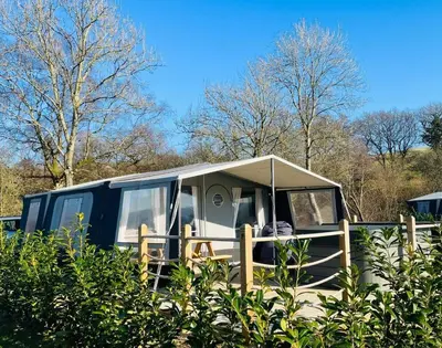 a camper with a tent on top of a fence at Heron in Nantmel