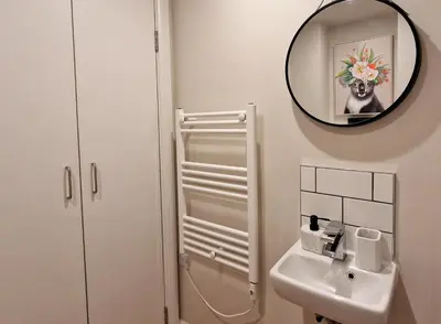 a bathroom with a sink and a mirror at The Academy House by Bevolve in Shrewsbury