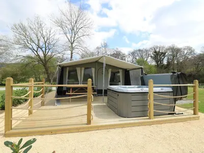 a tent with a hot tub on a wooden deck at Salmon in Nantmel