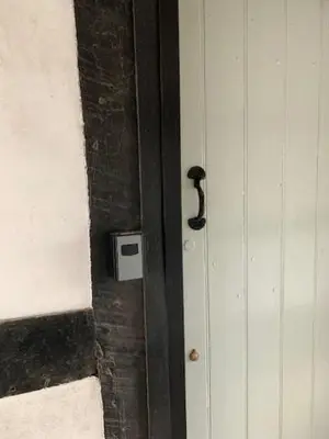 a door with a black handle on a building at Corve Cottage Historic cottage in beautiful ludlow in Ludlow