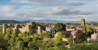 a view of a city with a castle at Corve Cottage Historic cottage in beautiful ludlow in Ludlow