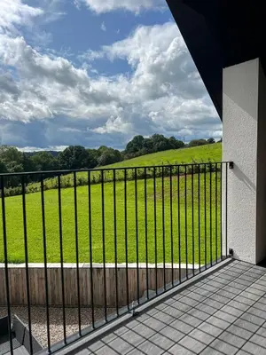 a black fence with a view of a field at The Loft Studio apartment - above detached new build garage in Llanymynech